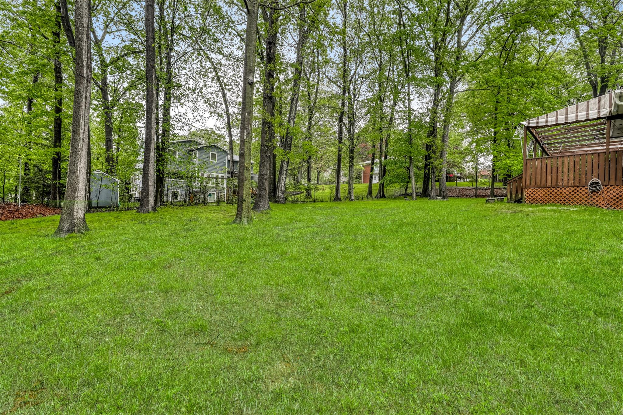 60 Highview Road Monsey, NY 10952 - Photo 4 of 26 a view of a grassy field with trees in the background