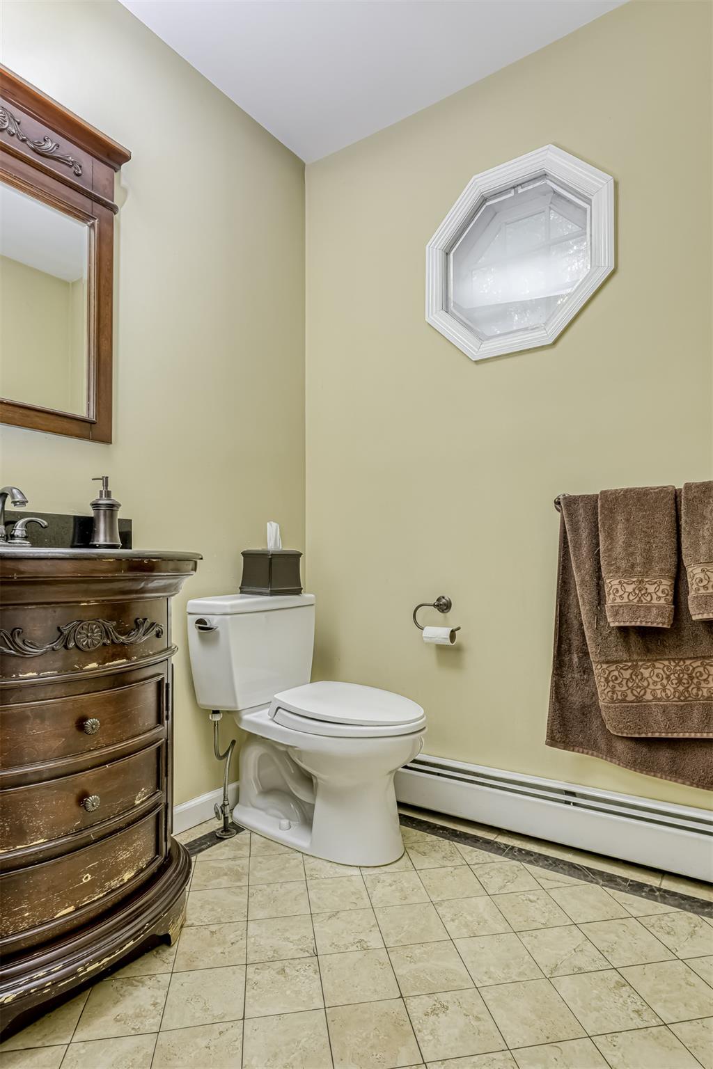 60 Highview Road Monsey, NY 10952 - Photo 8 of 26 a bathroom with a toilet sink and mirror