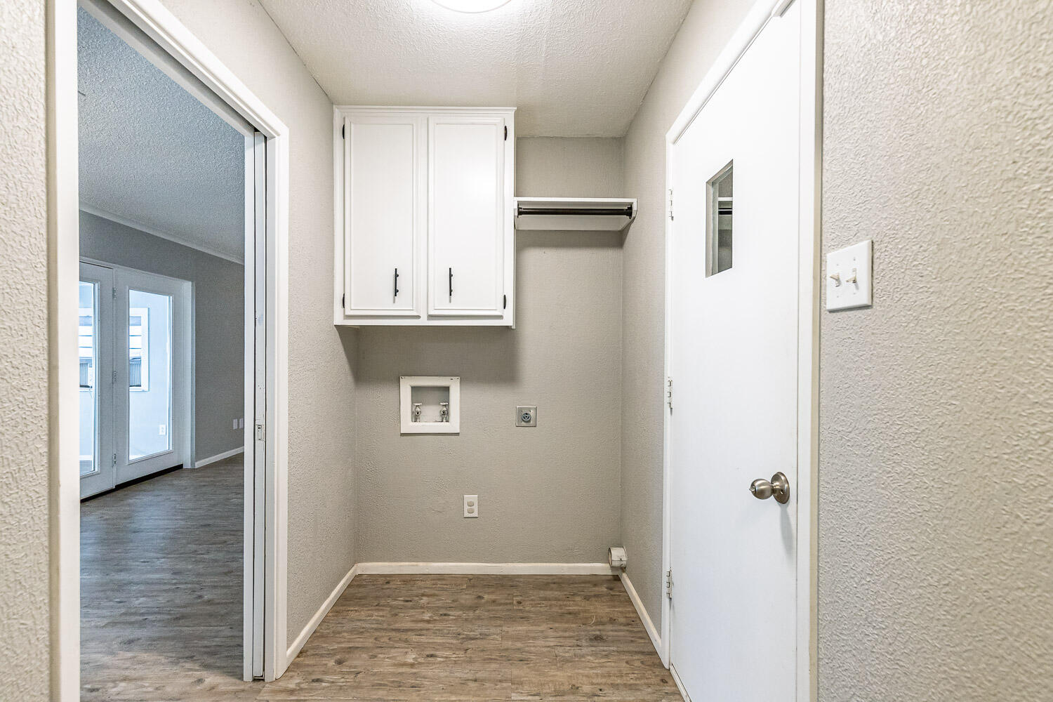 9611 Bangor Avenue Lubbock, TX 79424 - Photo 12 of 29 a view of kitchen with hallway and cabinets