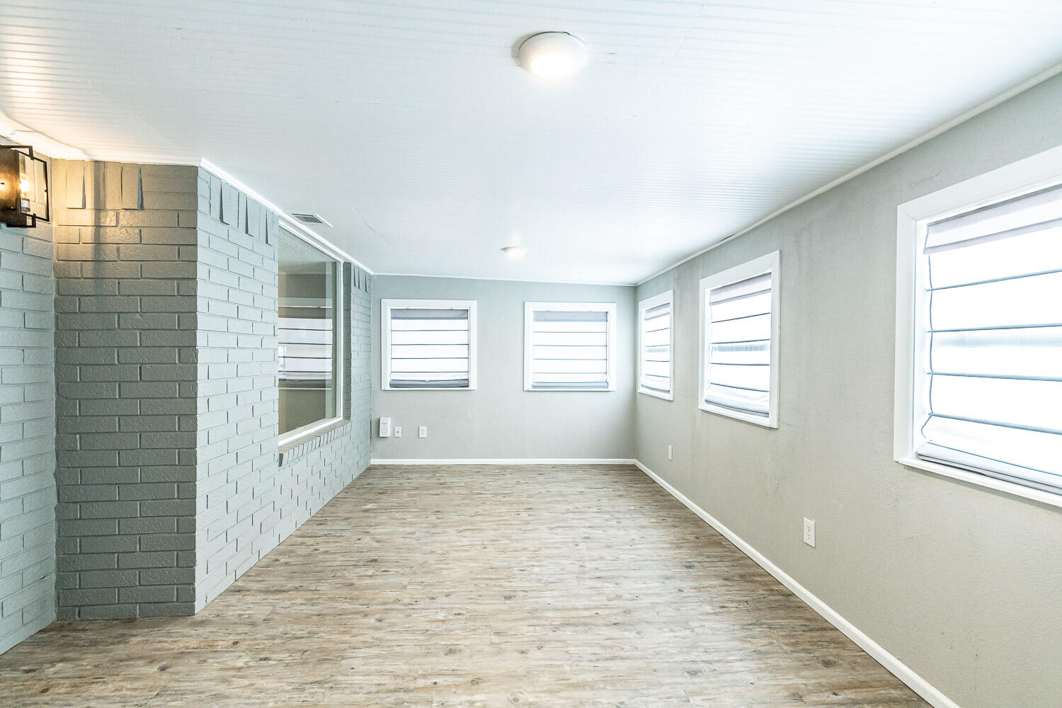 9611 Bangor Avenue Lubbock, TX 79424 - Photo 15 of 29 a view of an empty room with a window