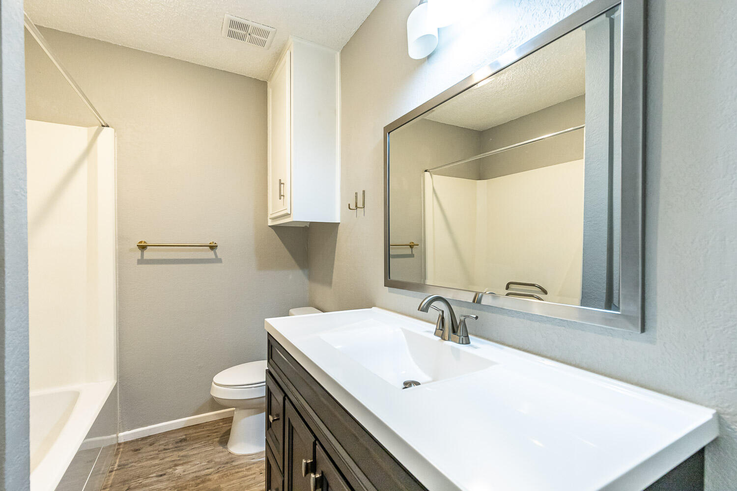 9611 Bangor Avenue Lubbock, TX 79424 - Photo 23 of 29 a bathroom with a sink toilet and mirror