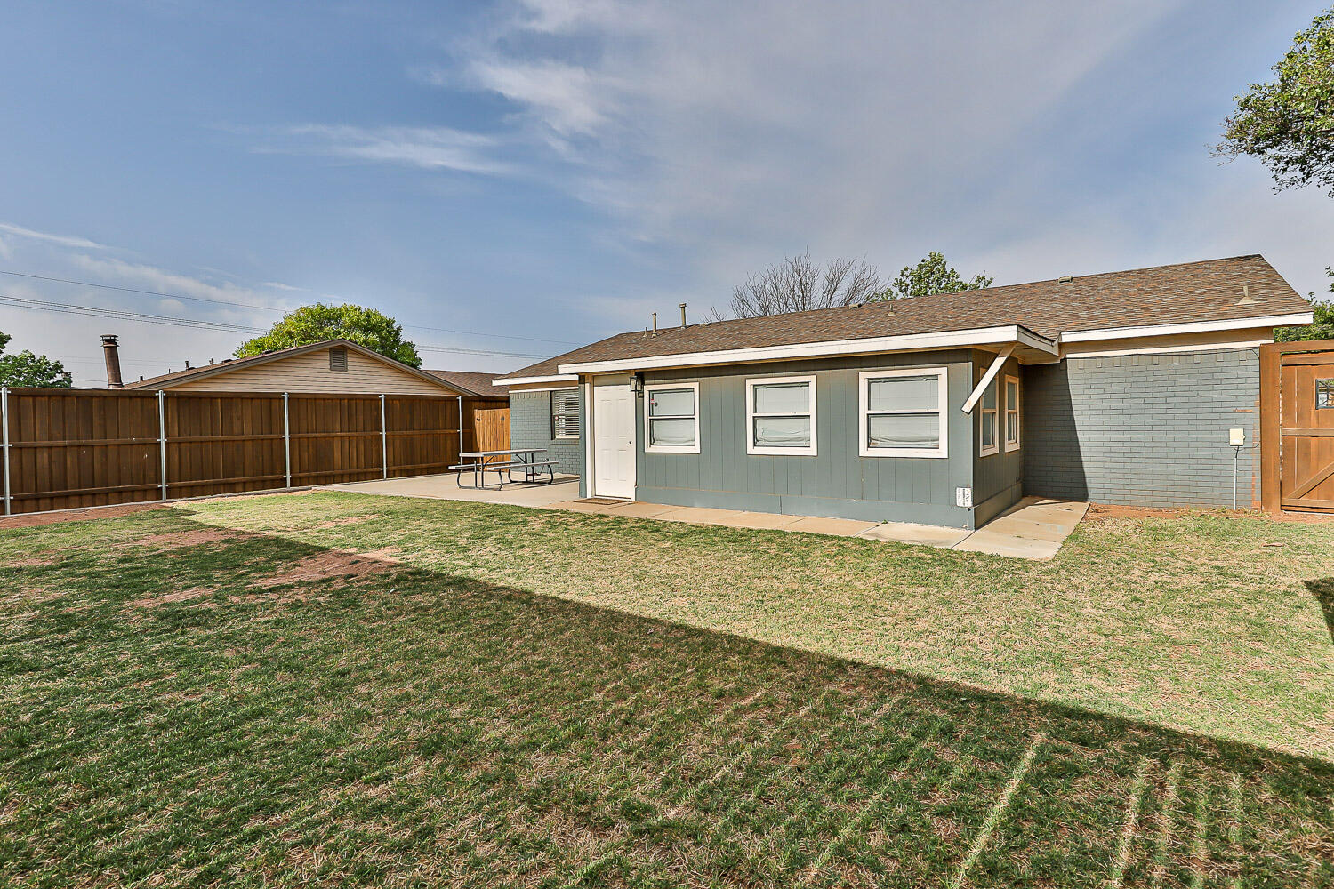 9611 Bangor Avenue Lubbock, TX 79424 - Photo 26 of 29 a front view of a house with a yard