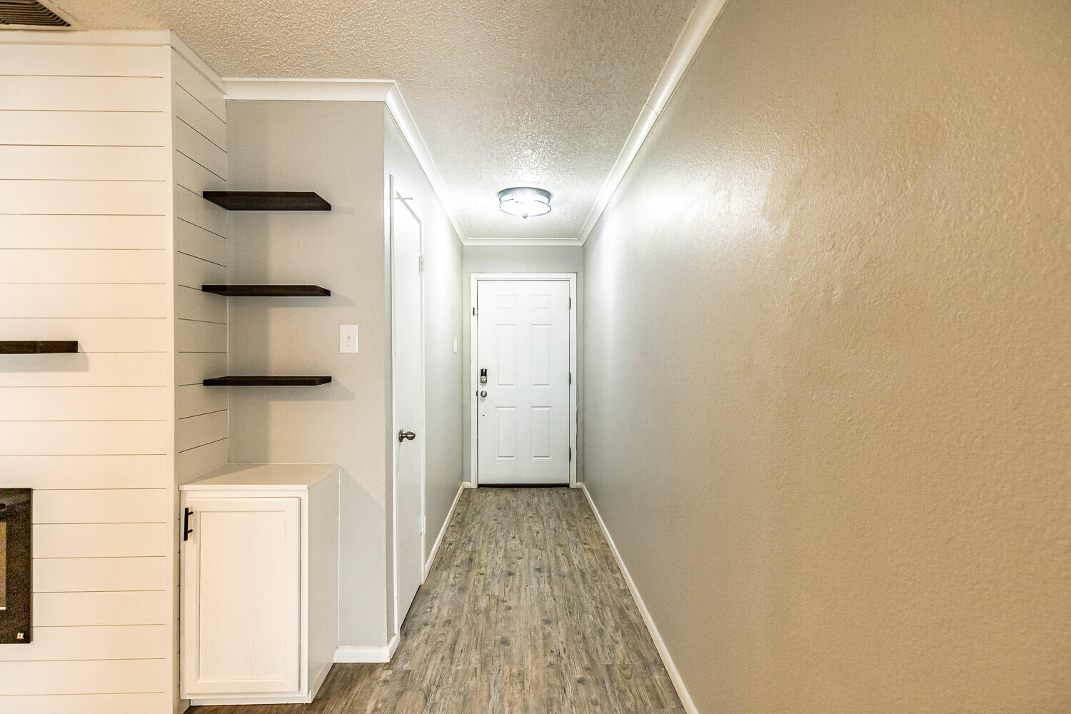 9611 Bangor Avenue Lubbock, TX 79424 - Photo 3 of 29 a view of a hallway with wooden floor and staircase