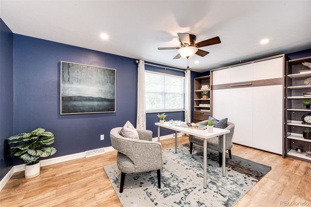 a workspace with furniture and a window