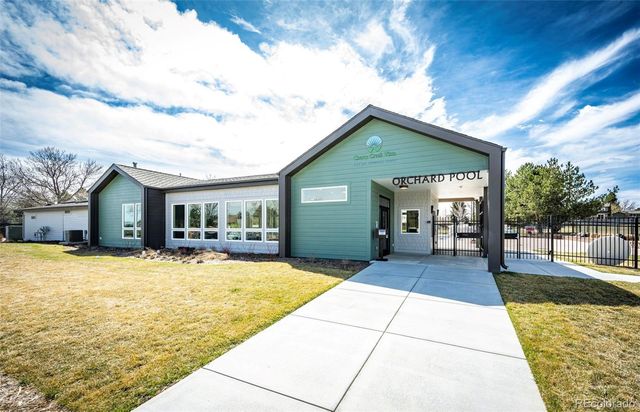 a view of swimming pool with outdoor seating