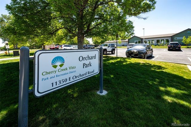 a view of a park with swings and slides