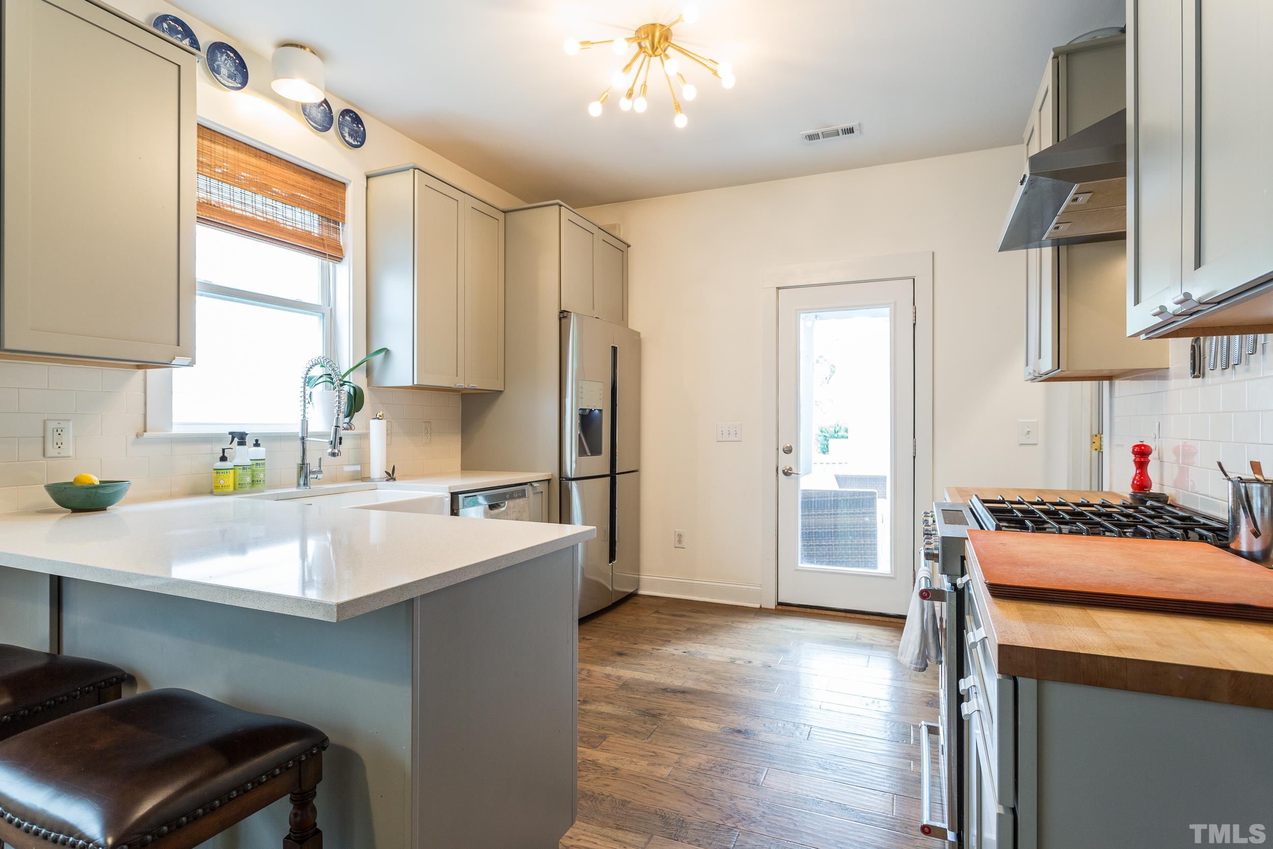 2116 Dunn Road Raleigh, NC 27614 - Photo 12 of 26 a kitchen with a sink appliances and cabinets