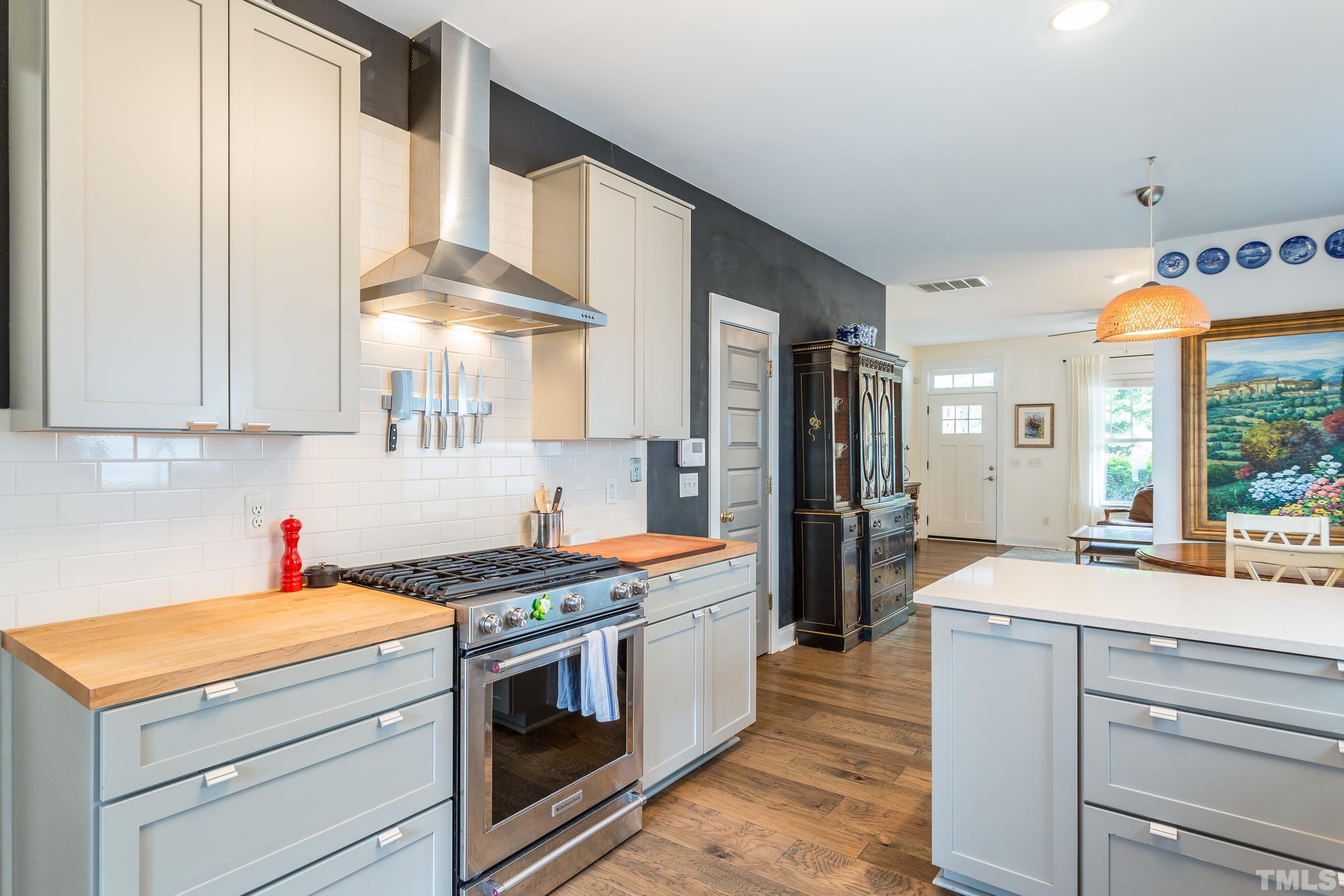 2116 Dunn Road Raleigh, NC 27614 - Photo 13 of 26 a kitchen with stainless steel appliances granite countertop a stove and a refrigerator