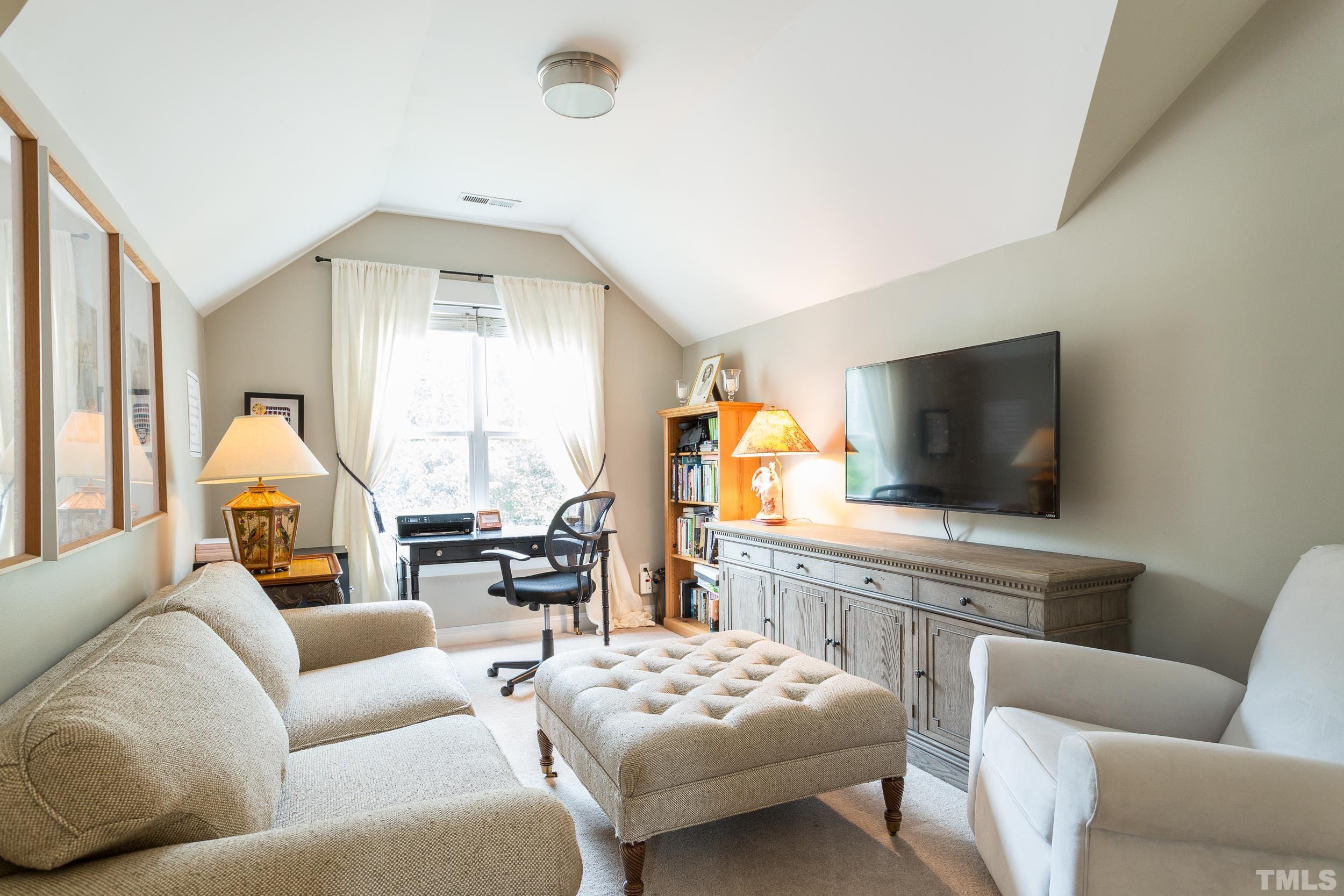 2116 Dunn Road Raleigh, NC 27614 - Photo 14 of 26 a living room with furniture and a flat screen tv