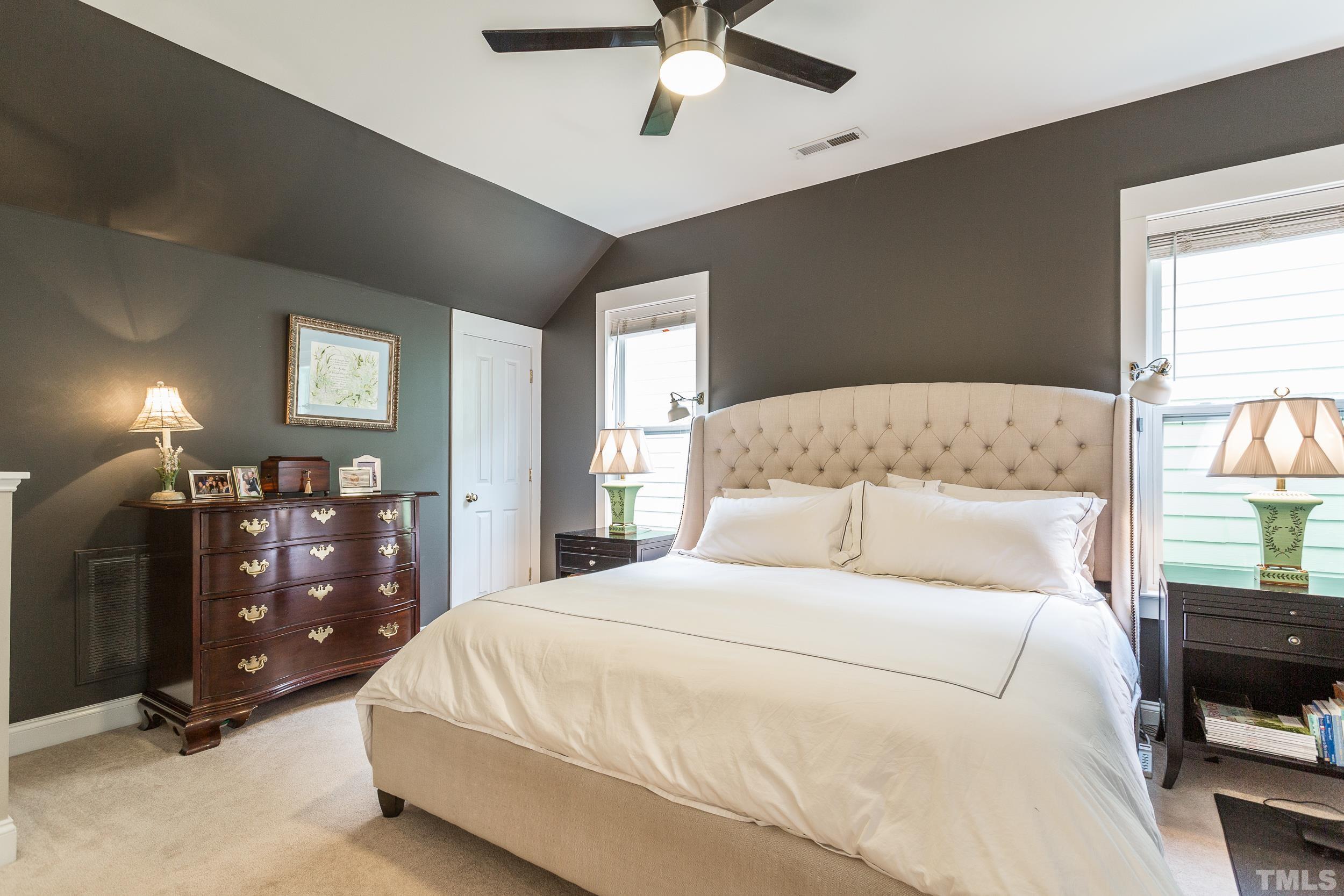 2116 Dunn Road Raleigh, NC 27614 - Photo 16 of 26 a bedroom with a bed and a chandelier