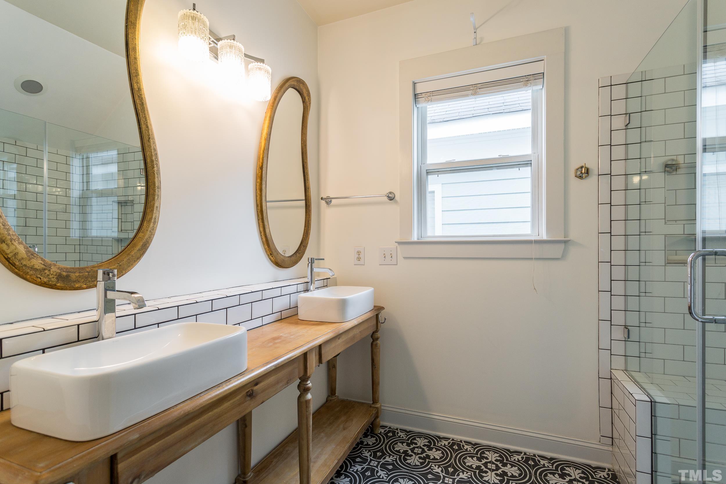 2116 Dunn Road Raleigh, NC 27614 - Photo 17 of 26 a bathroom with a sink a toilet and a mirror
