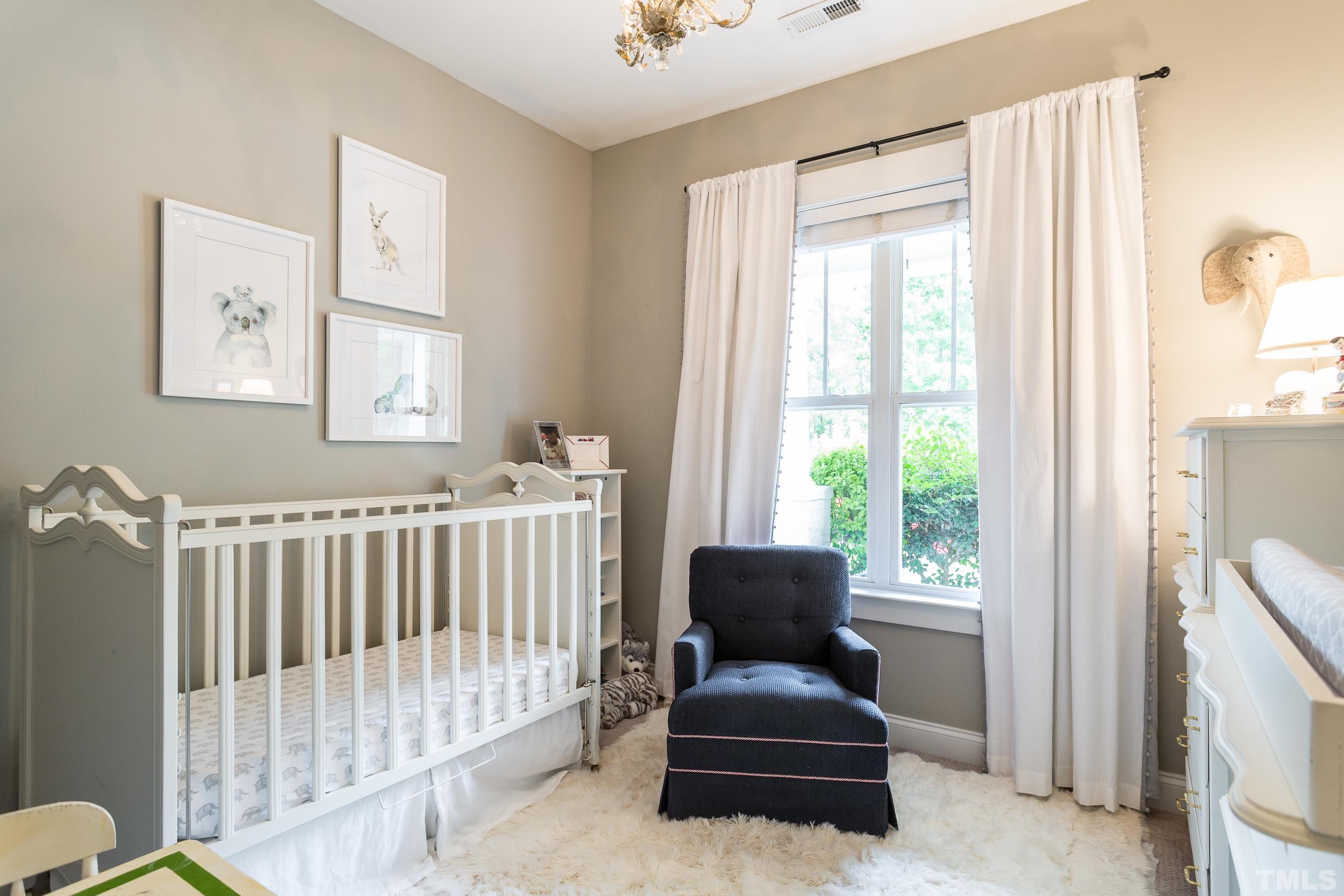 2116 Dunn Road Raleigh, NC 27614 - Photo 19 of 26 a bedroom with furniture and a window