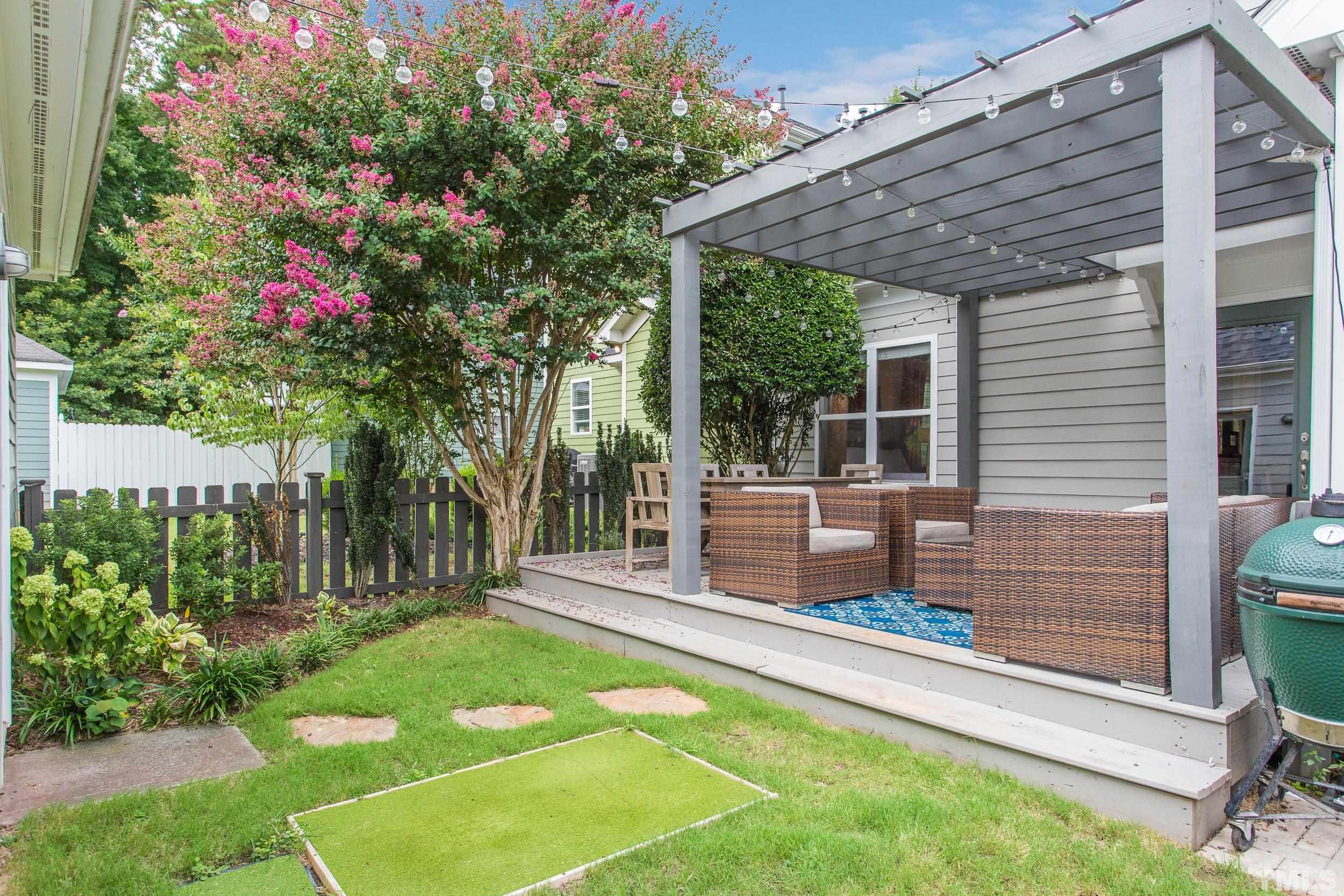 2116 Dunn Road Raleigh, NC 27614 - Photo 23 of 26 a backyard of a house with seating space
