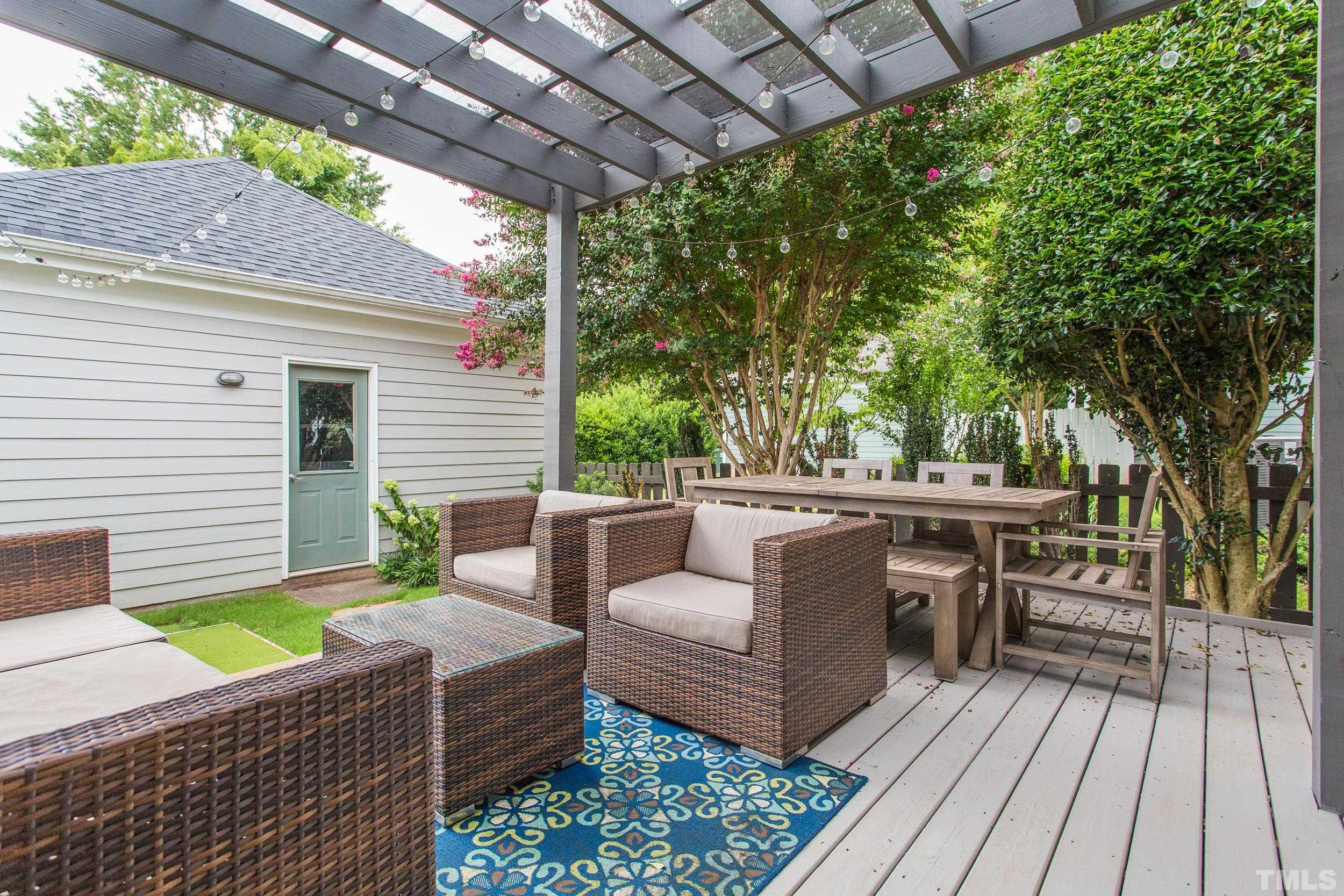 2116 Dunn Road Raleigh, NC 27614 - Photo 25 of 26 a outdoor living space with patio furniture and wooden floor
