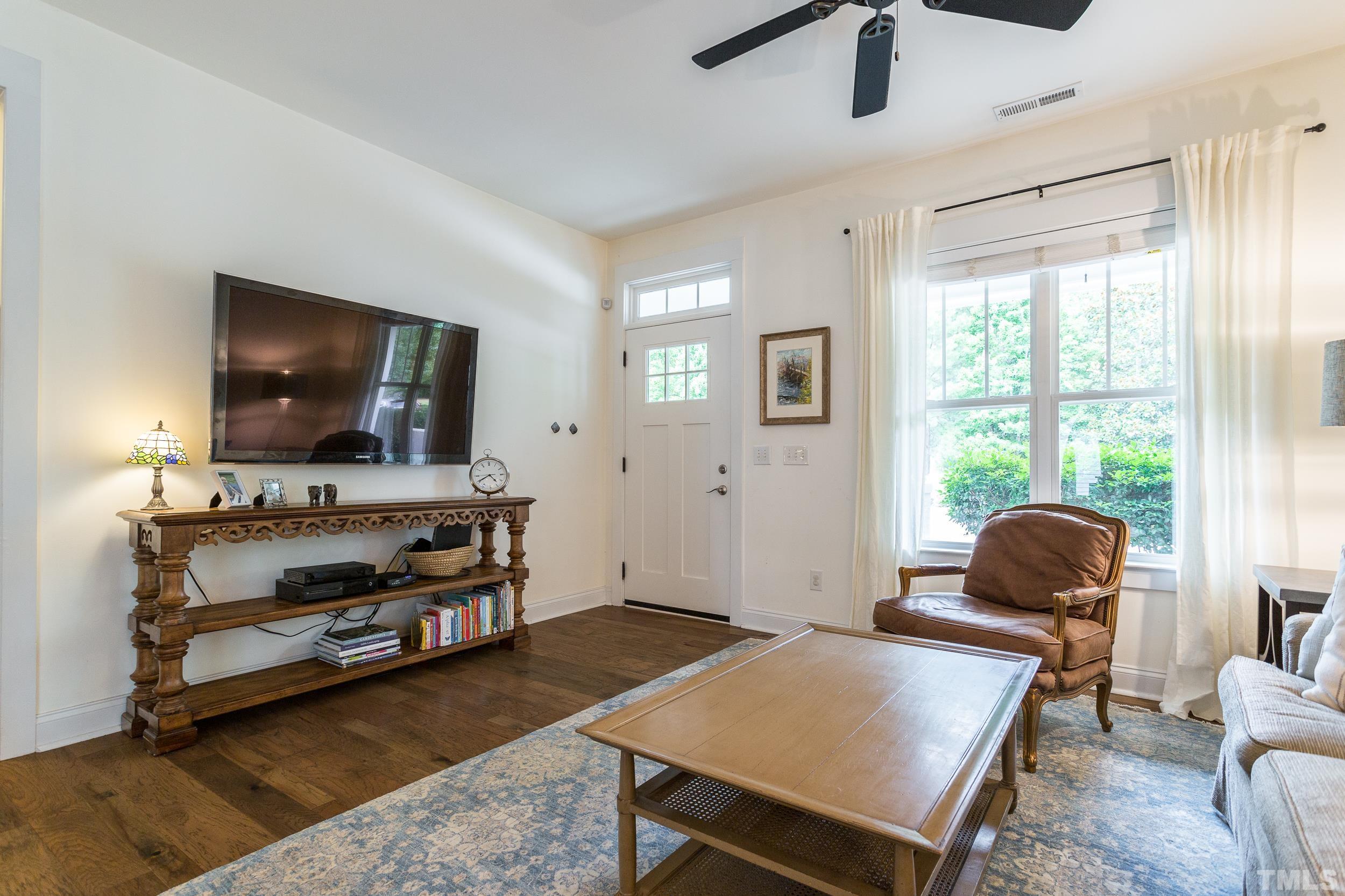 2116 Dunn Road Raleigh, NC 27614 - Photo 6 of 26 a living room with furniture and a flat screen tv