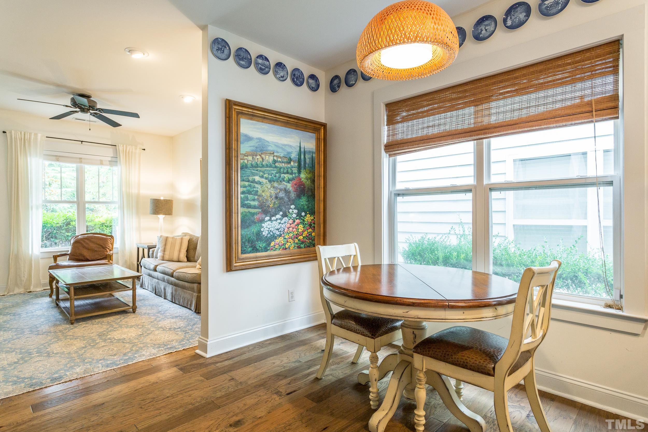 2116 Dunn Road Raleigh, NC 27614 - Photo 9 of 26 a view of a dining room with furniture wooden floor and a chandelier