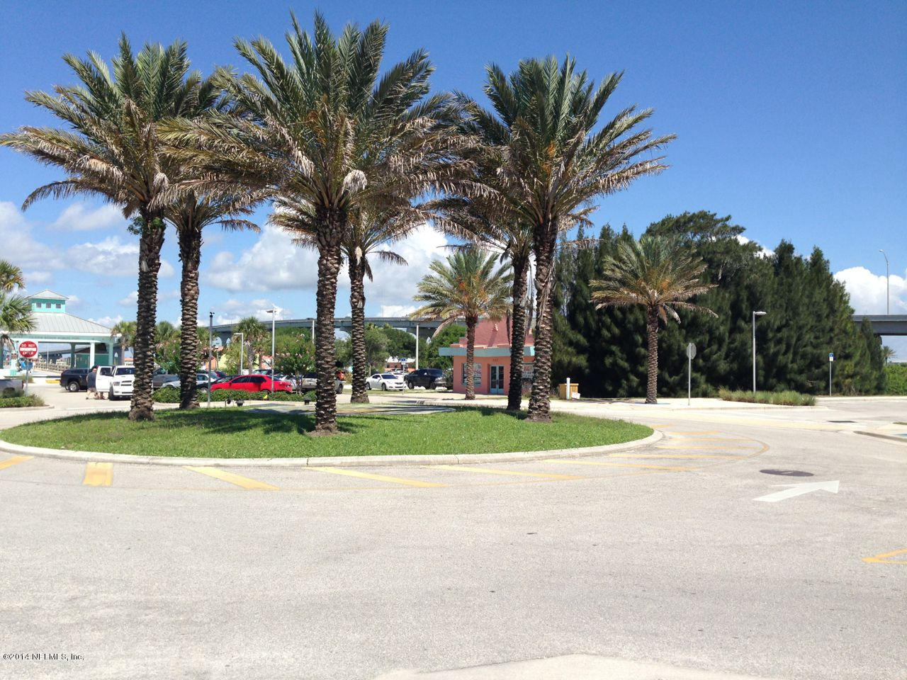 160 Ferrol Road St. Augustine, FL 32084 - Photo 3 of 16 a view of a white house with a big yard and palm trees