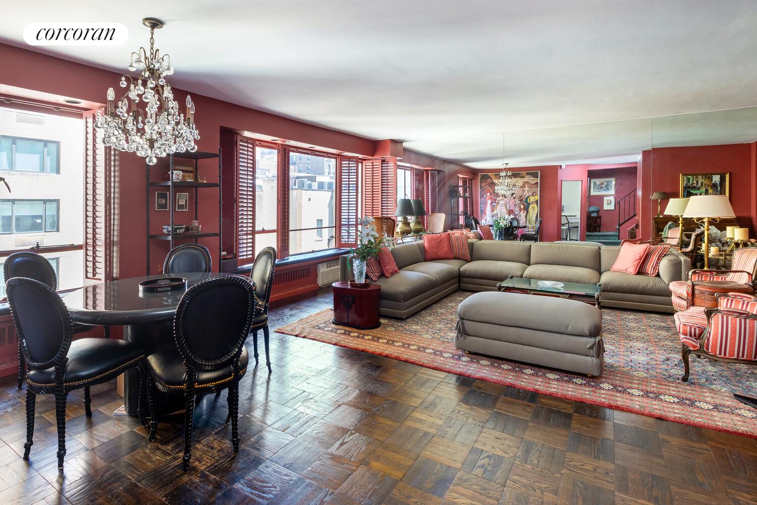 1050 5th Avenue, Unit 11/12A Manhattan, NY 10028 - Photo 2 of 13 a living room with furniture and a chandelier