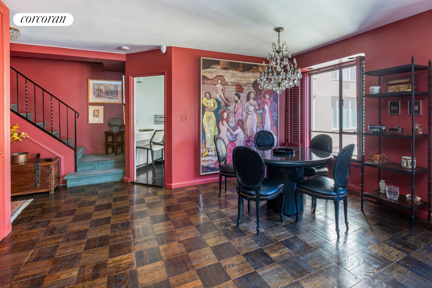 1050 5th Avenue, Unit 11/12A Manhattan, NY 10028 - Photo 3 of 13 a view of a dining room with furniture and chandelier