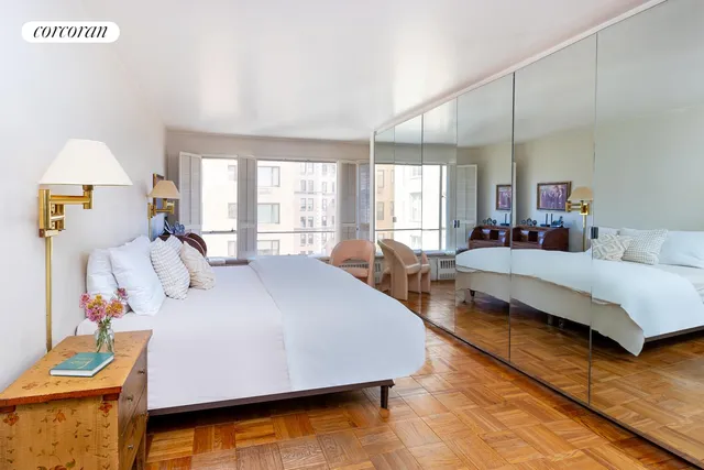 a kitchen with sink a stove and white cabinets