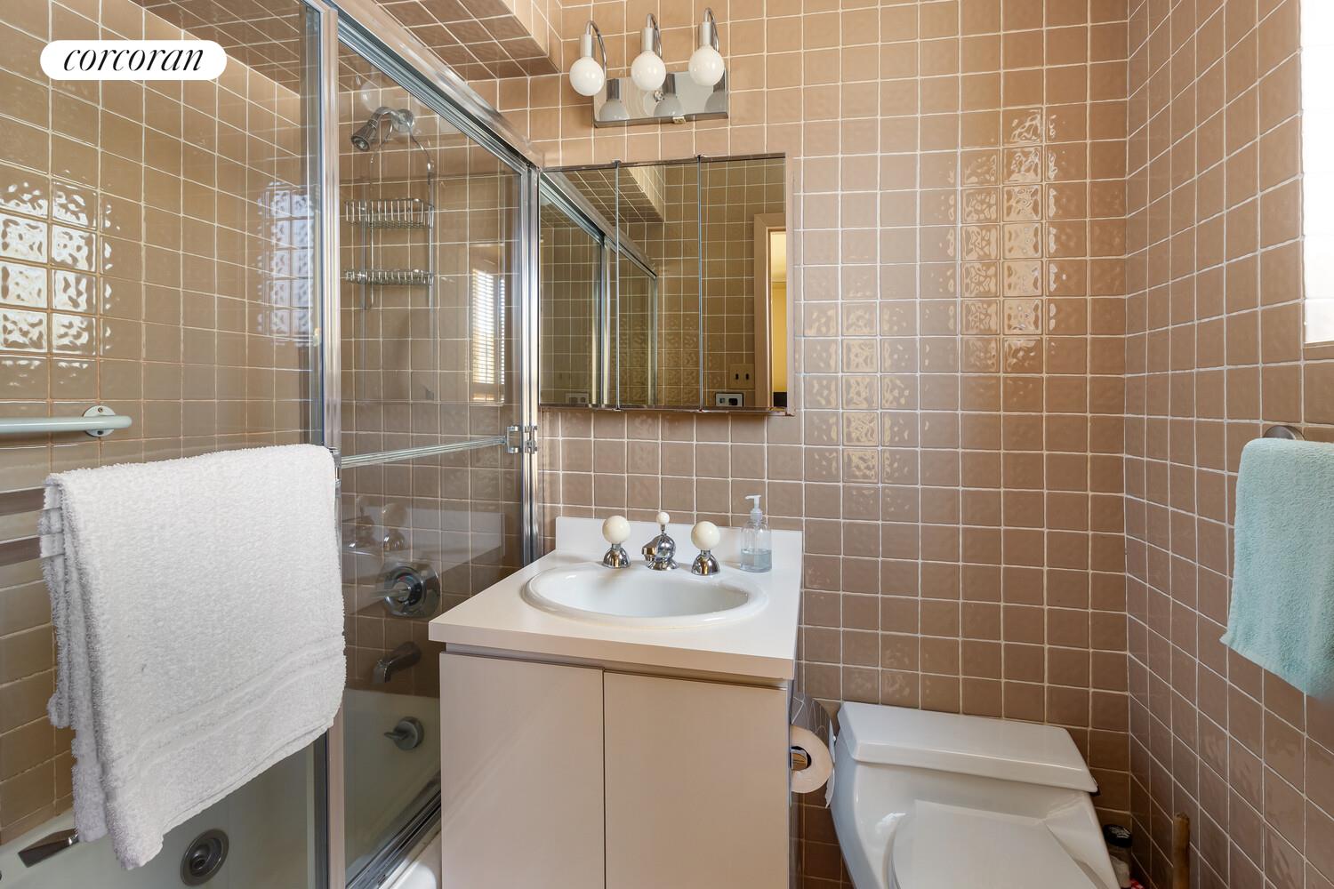 1050 5th Avenue, Unit 11/12A Manhattan, NY 10028 - Photo 8 of 13 a bathroom with a sink toilet and shower