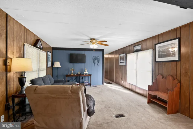 a hallway with a table and chairs