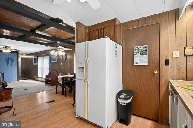 a kitchen with stainless steel appliances granite countertop a sink a stove and cabinets