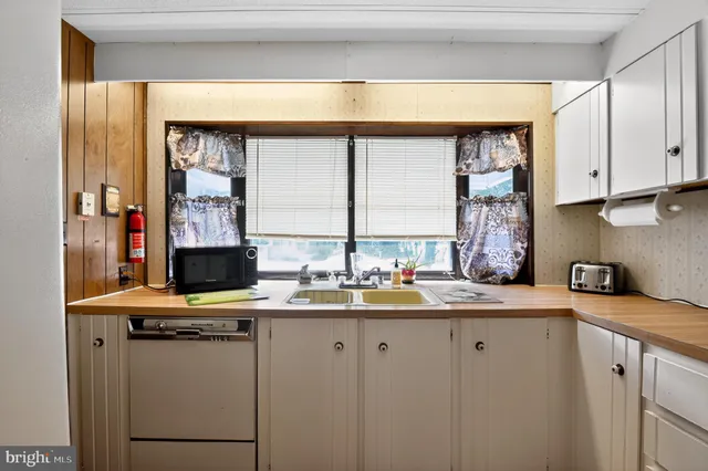 a kitchen with a stove and a refrigerator