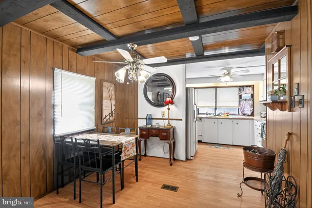 a room with furniture and musical instruments