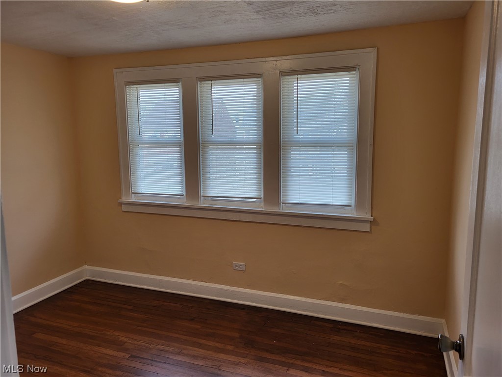 955 Nela View Road Cleveland Heights, OH 44112 - Photo 8 of 34 Empty room with dark wood-type flooring and plenty of natural light