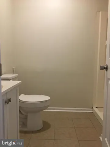 a bathroom with a toilet and a sink