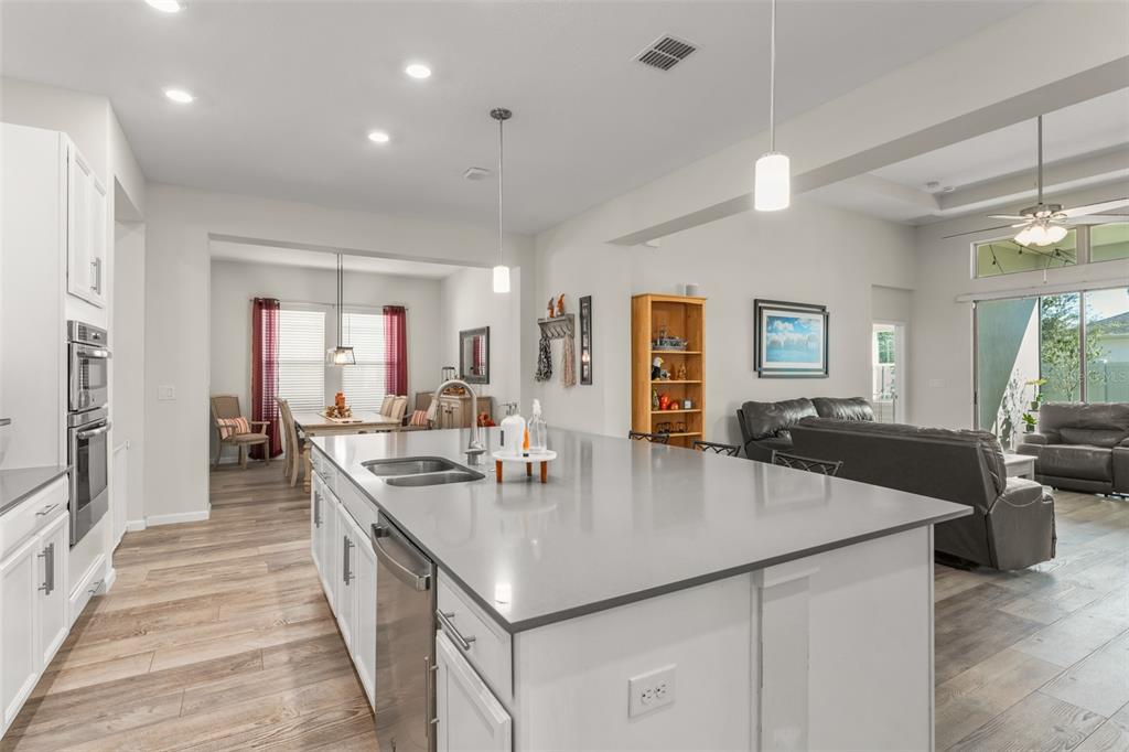 375 Dancing Water Drive Winter Springs, FL 32708 - Photo 12 of 73 a large kitchen with stainless steel appliances granite countertop a lot of counter space