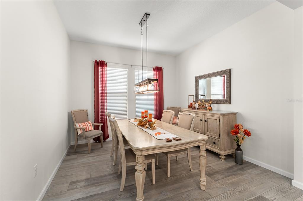 375 Dancing Water Drive Winter Springs, FL 32708 - Photo 14 of 73 a view of a dining room with furniture and window