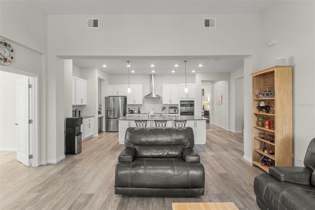 375 Dancing Water Drive Winter Springs, FL 32708 - Photo 18 of 73 a living room with furniture and a wooden floor