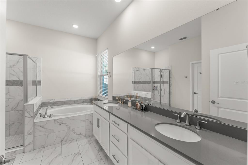 375 Dancing Water Drive Winter Springs, FL 32708 - Photo 24 of 73 a bathroom with a granite countertop sink mirror and double