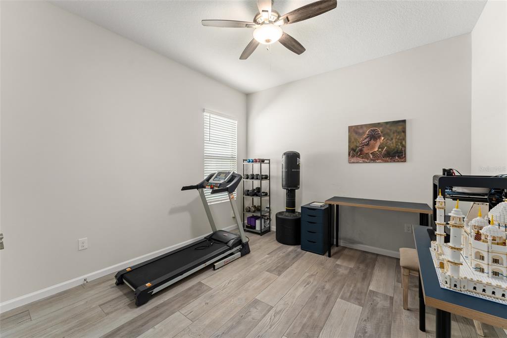 375 Dancing Water Drive Winter Springs, FL 32708 - Photo 37 of 73 a view of a workspace with furniture and gym equipment
