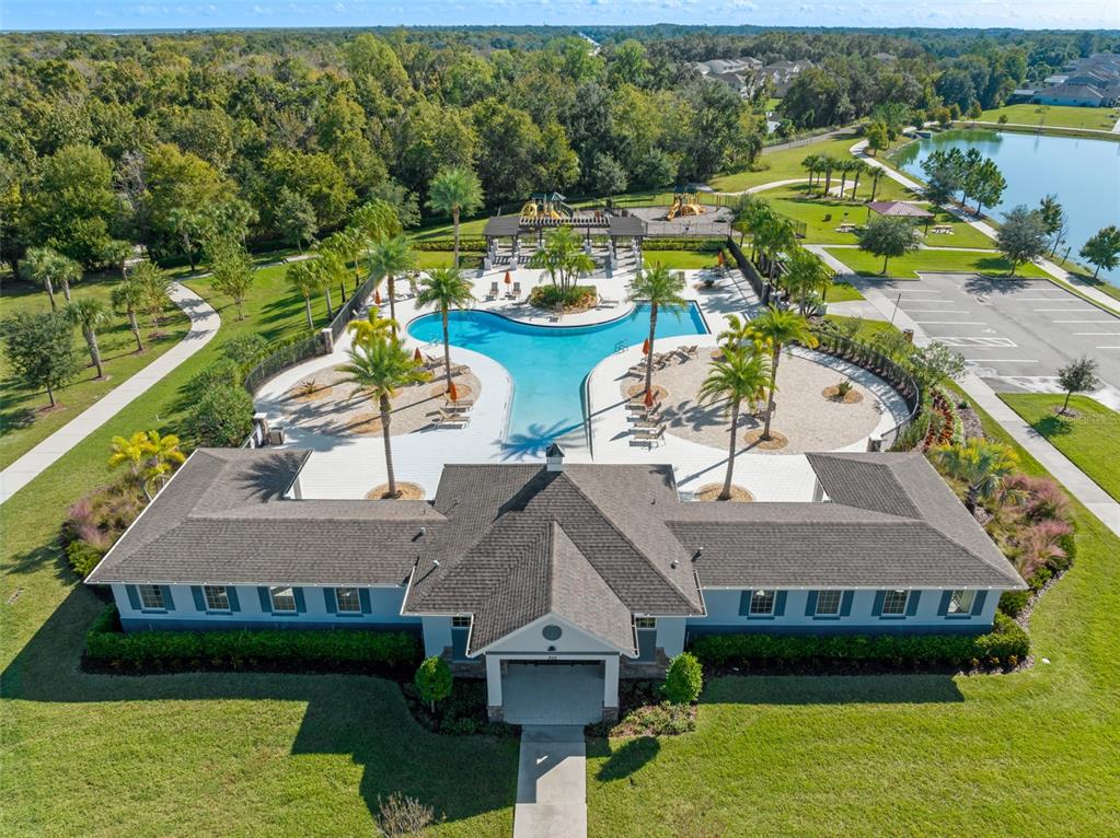 375 Dancing Water Drive Winter Springs, FL 32708 - Photo 52 of 73 an aerial view of a house with swimming pool patio and lake view
