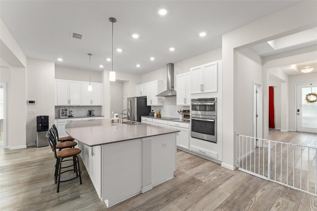 375 Dancing Water Drive Winter Springs, FL 32708 - Photo 6 of 73 a kitchen with a sink and chairs