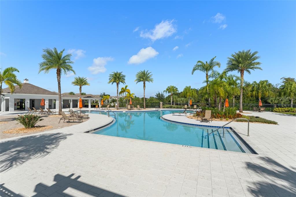 375 Dancing Water Drive Winter Springs, FL 32708 - Photo 64 of 73 a view of a swimming pool and lounge chair
