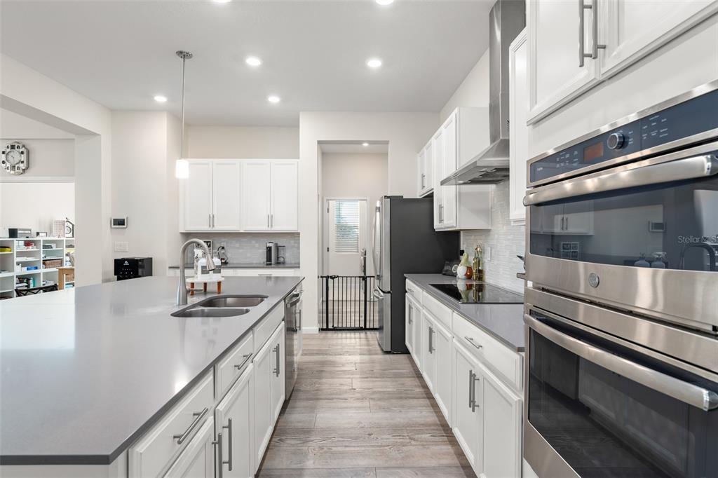 375 Dancing Water Drive Winter Springs, FL 32708 - Photo 8 of 73 a kitchen with stainless steel appliances a sink and a refrigerator