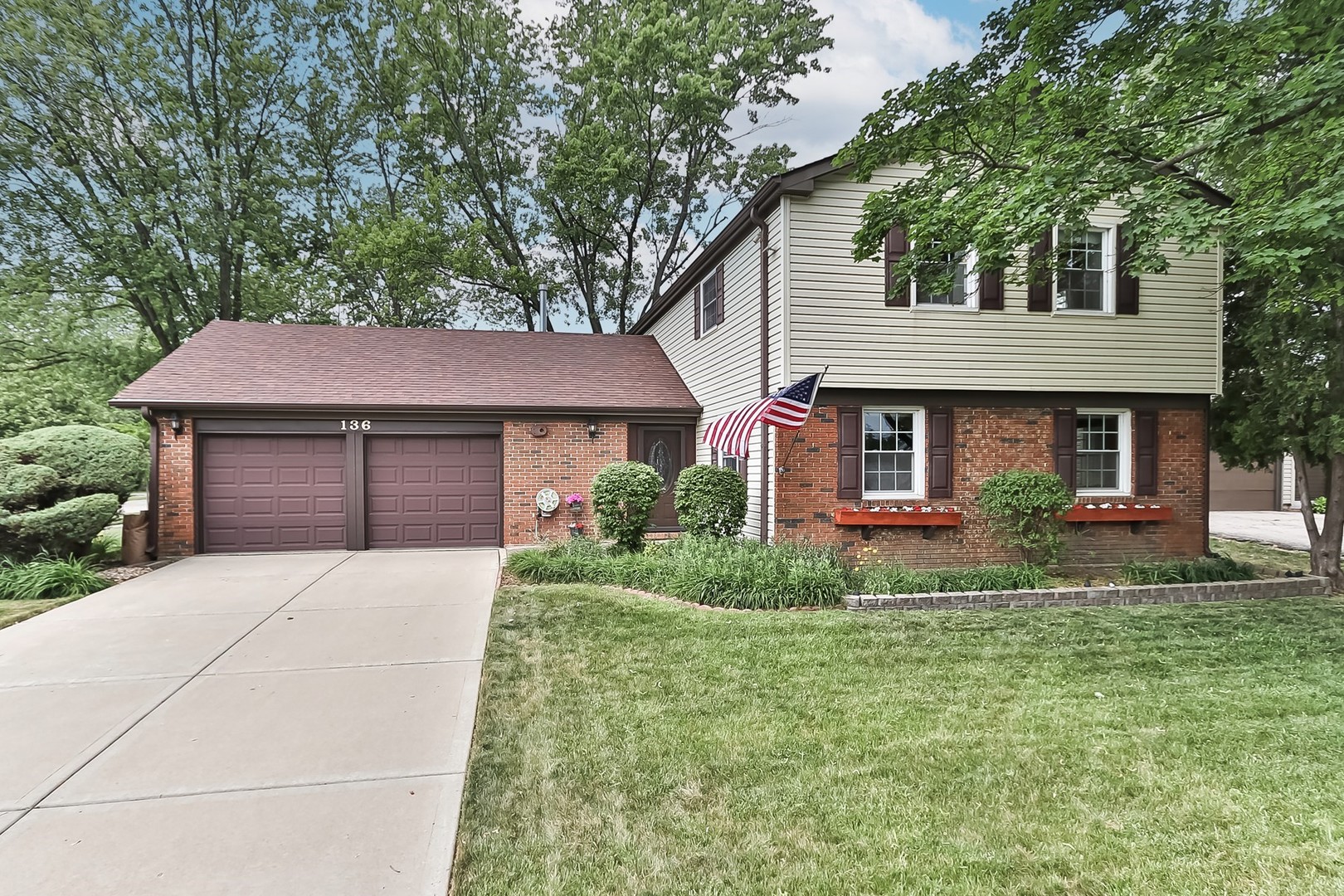 136 Weidner Road Buffalo Grove, IL 60089 - Photo 1 of 41 a front view of a house with a yard and garage