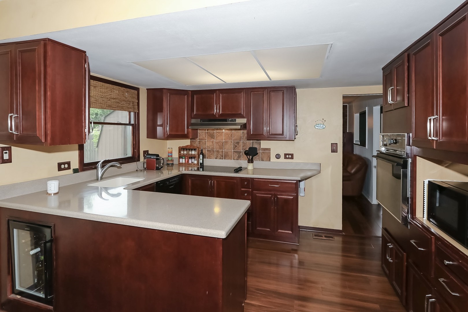 136 Weidner Road Buffalo Grove, IL 60089 - Photo 11 of 41 a kitchen with kitchen island granite countertop a sink stove and refrigerator