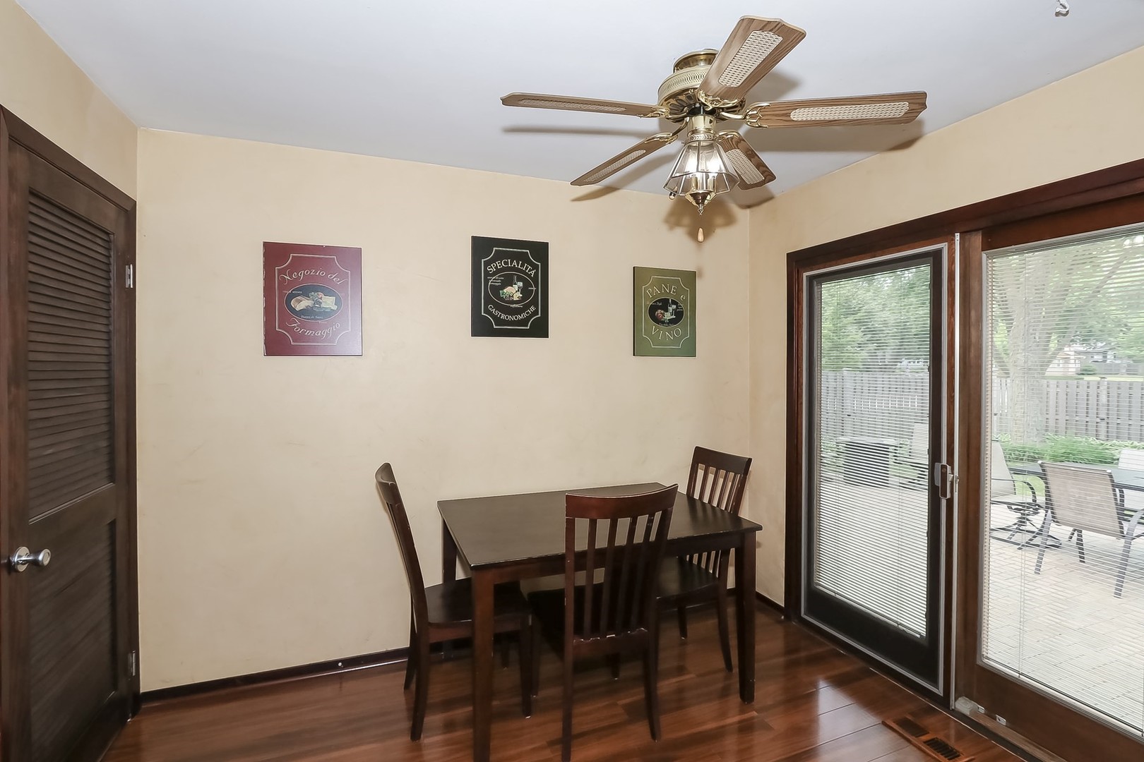 136 Weidner Road Buffalo Grove, IL 60089 - Photo 13 of 41 a view of a dining room with furniture window and wooden floor