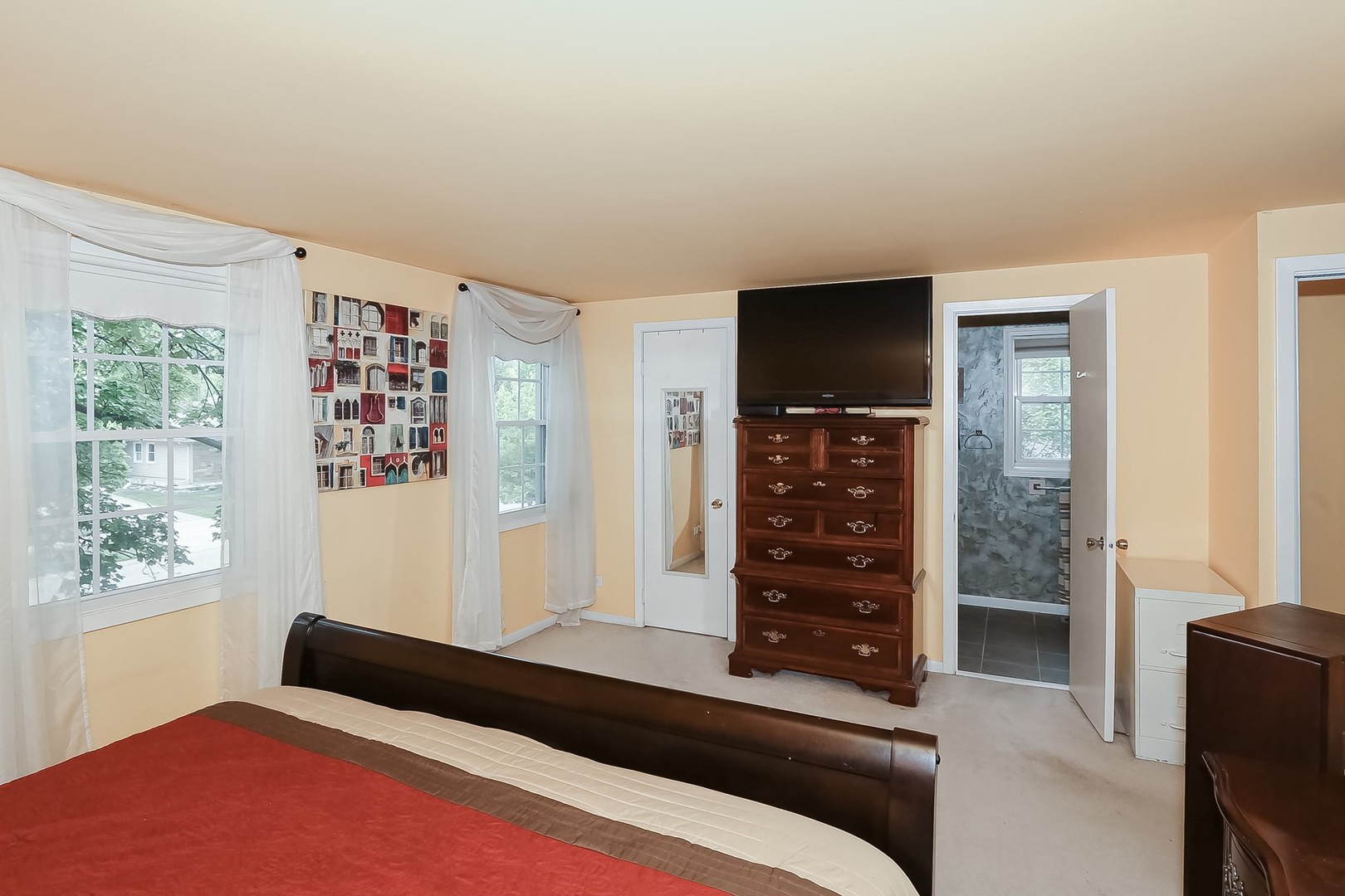 136 Weidner Road Buffalo Grove, IL 60089 - Photo 20 of 41 a bedroom with a bed and a window