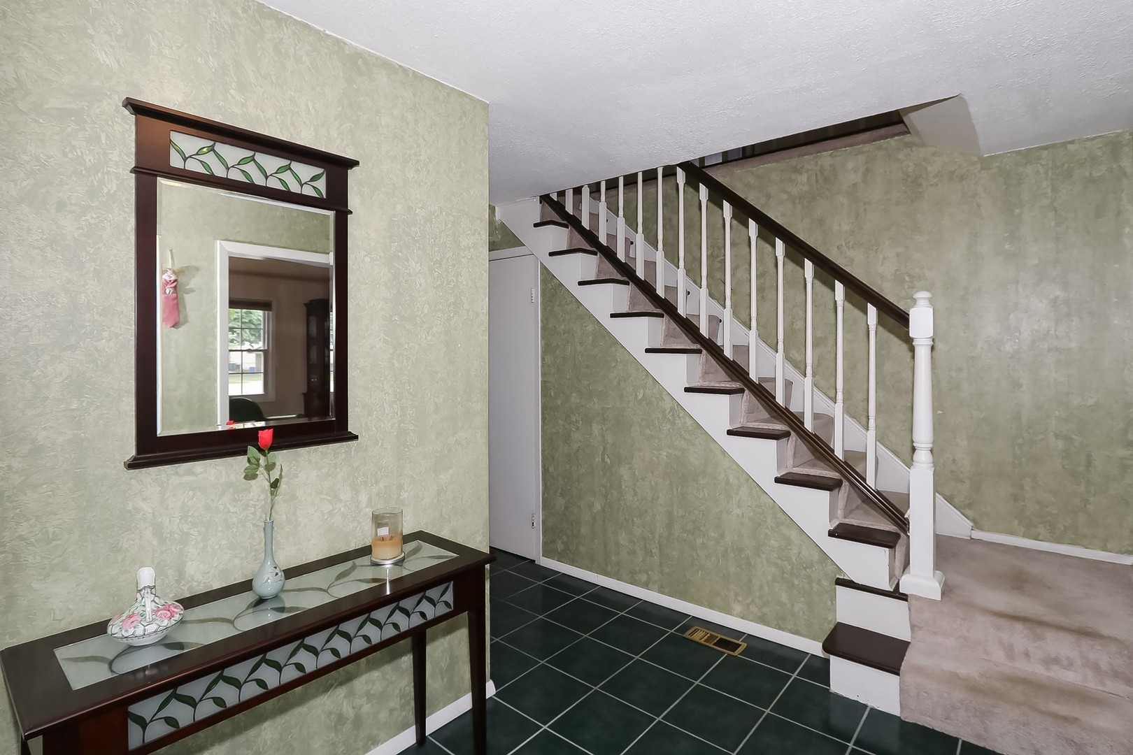 136 Weidner Road Buffalo Grove, IL 60089 - Photo 3 of 41 a view of a hallway with wooden floor and staircase