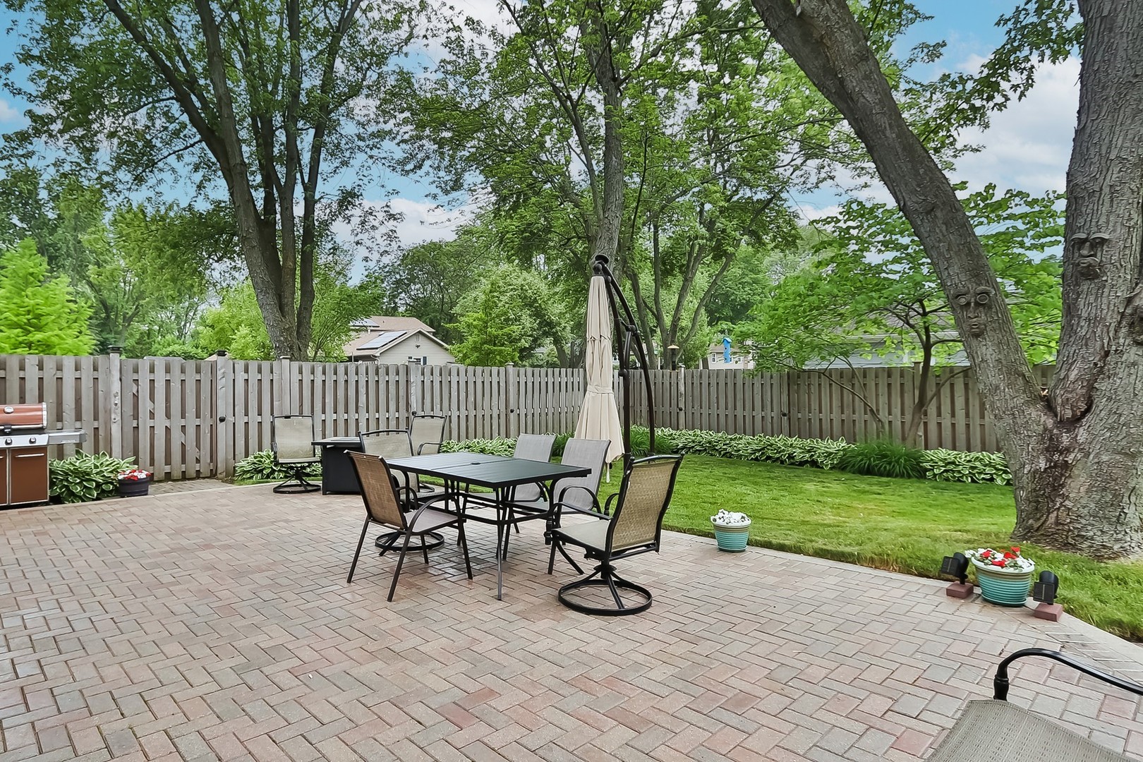 136 Weidner Road Buffalo Grove, IL 60089 - Photo 31 of 41 a view of a chairs and table in the back yard