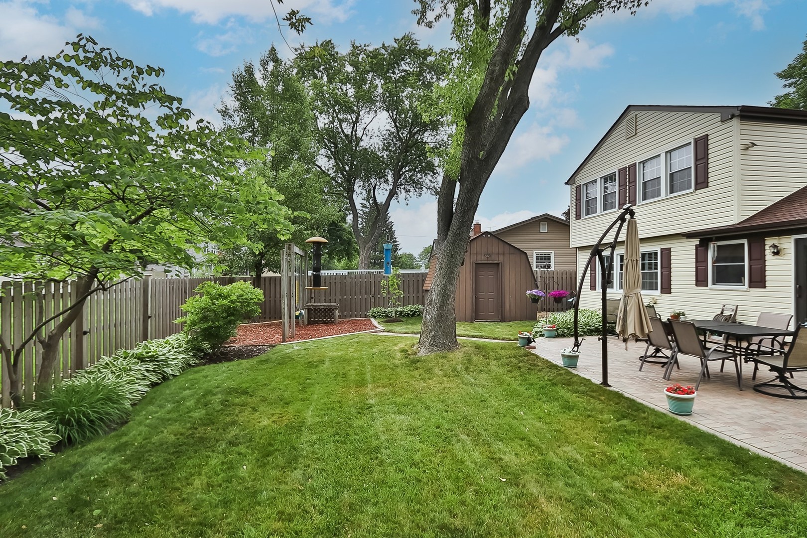 136 Weidner Road Buffalo Grove, IL 60089 - Photo 33 of 41 a view of a house with a yard porch and sitting area