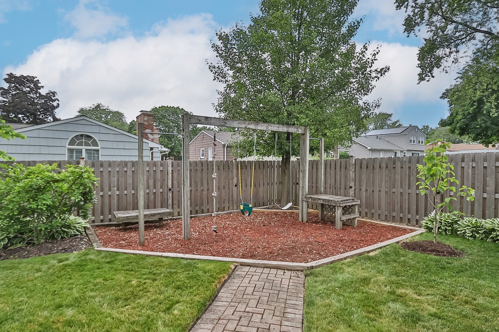 136 Weidner Road Buffalo Grove, IL 60089 - Photo 35 of 41 a view of a chair and table in backyard of the house