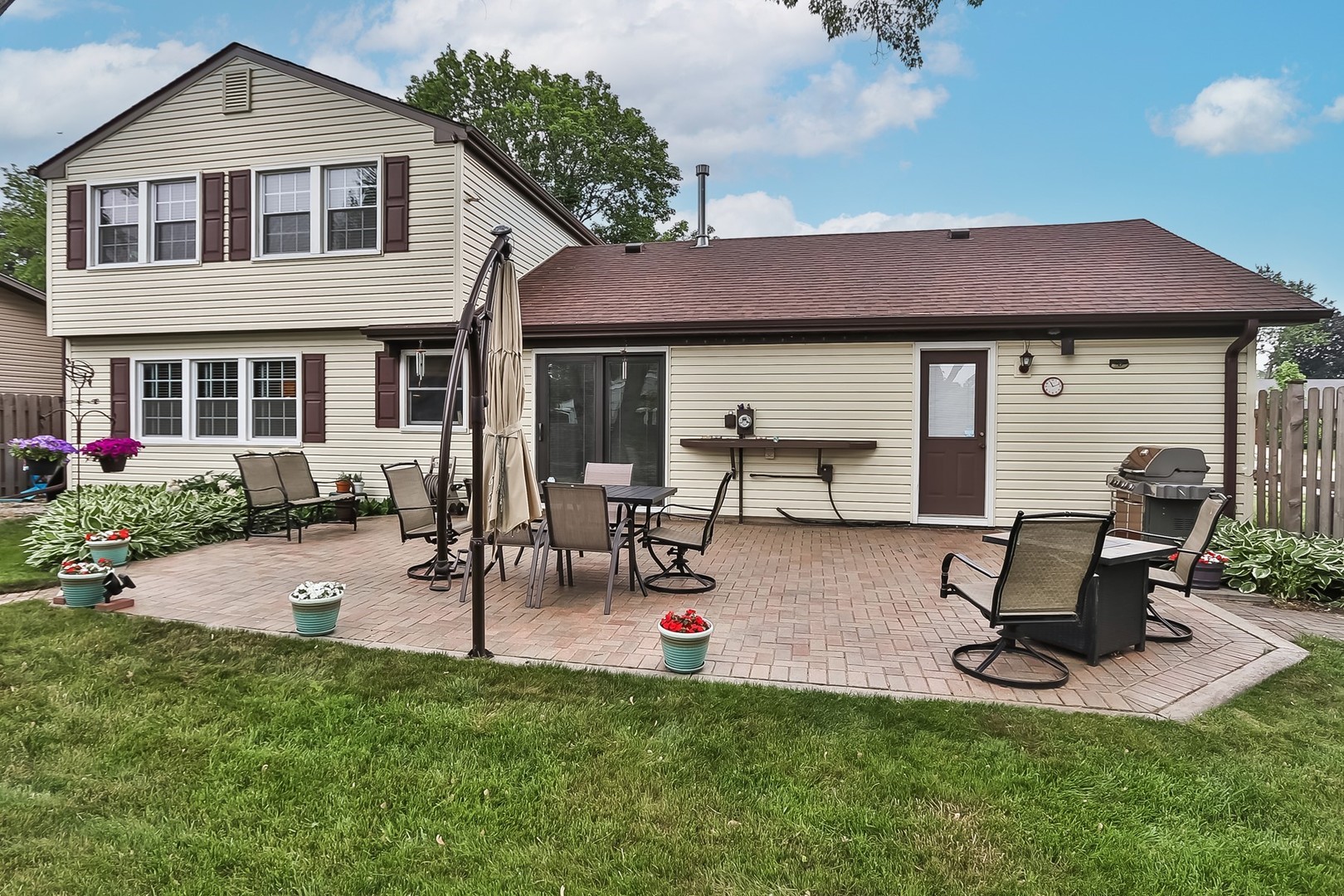 136 Weidner Road Buffalo Grove, IL 60089 - Photo 37 of 41 a view of a house with a patio and a yard