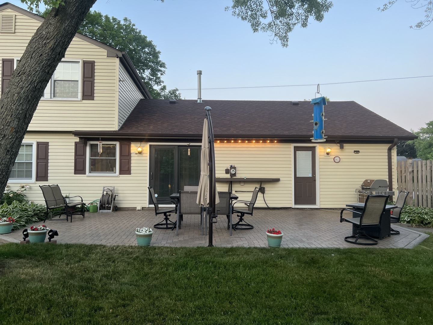 136 Weidner Road Buffalo Grove, IL 60089 - Photo 41 of 41 a view of a patio with table and chairs under an umbrella